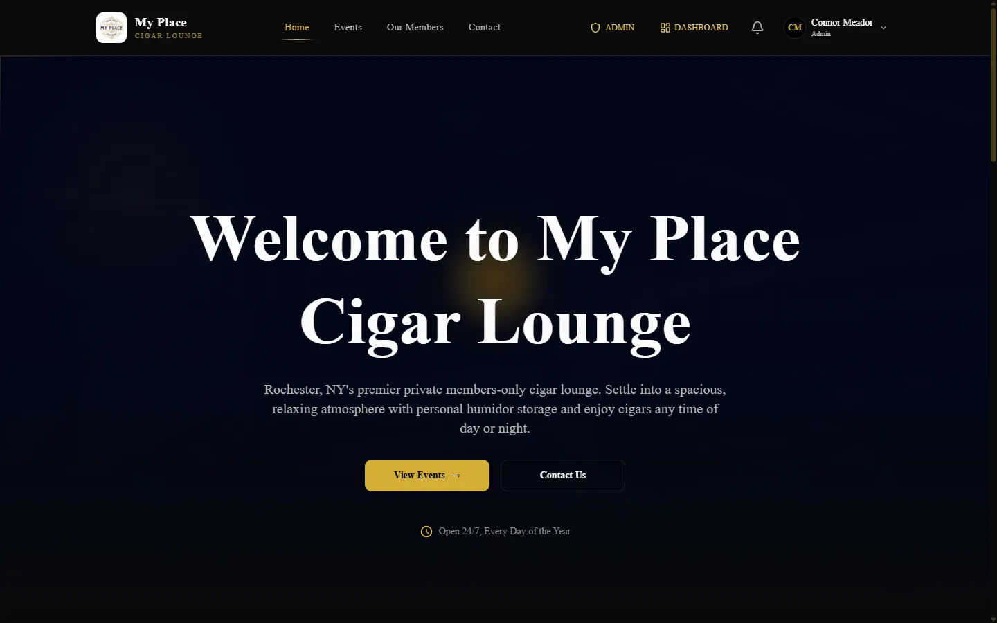 Dark hero with gold accents and centered serif headline on the public homepage